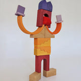 A abstract robot structure made from wooden blocks from the the Grimms desert sand set
