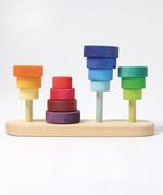 GRimms wooden fabuto set showing the disks stacked upright and inverted on the base 