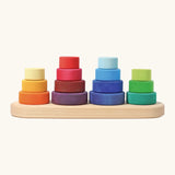 Grimms fabuto stacking toy. Includes 14 wooden disks in a rainbow palette and a base with pegs. Perfect for stacking and learning games