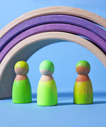 Set of 3 Grimms handcrafted wooden peg dolls painted in bright green standing under rainbow arches