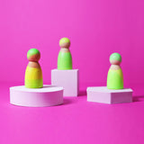 Set of 3 Grimms handcrafted wooden peg dolls painted in bright green. Perfect for open ended play and story sacks