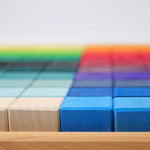 A close up of the side of the Grimm's Large Mosaic Square with the block in the wooden tray. 