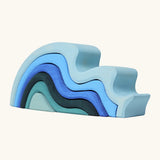 Grimms handcrafted wooden large water wave set in shades of blue. Perfect for stacking and open ended play