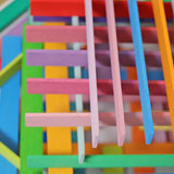 Grimm's handcrafted wooden Leonardo sticks showing rows of sticks stacked on top of eachother
