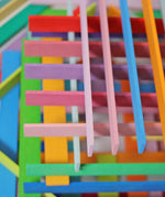 Grimm's handcrafted wooden Leonardo sticks showing rows of sticks stacked on top of eachother