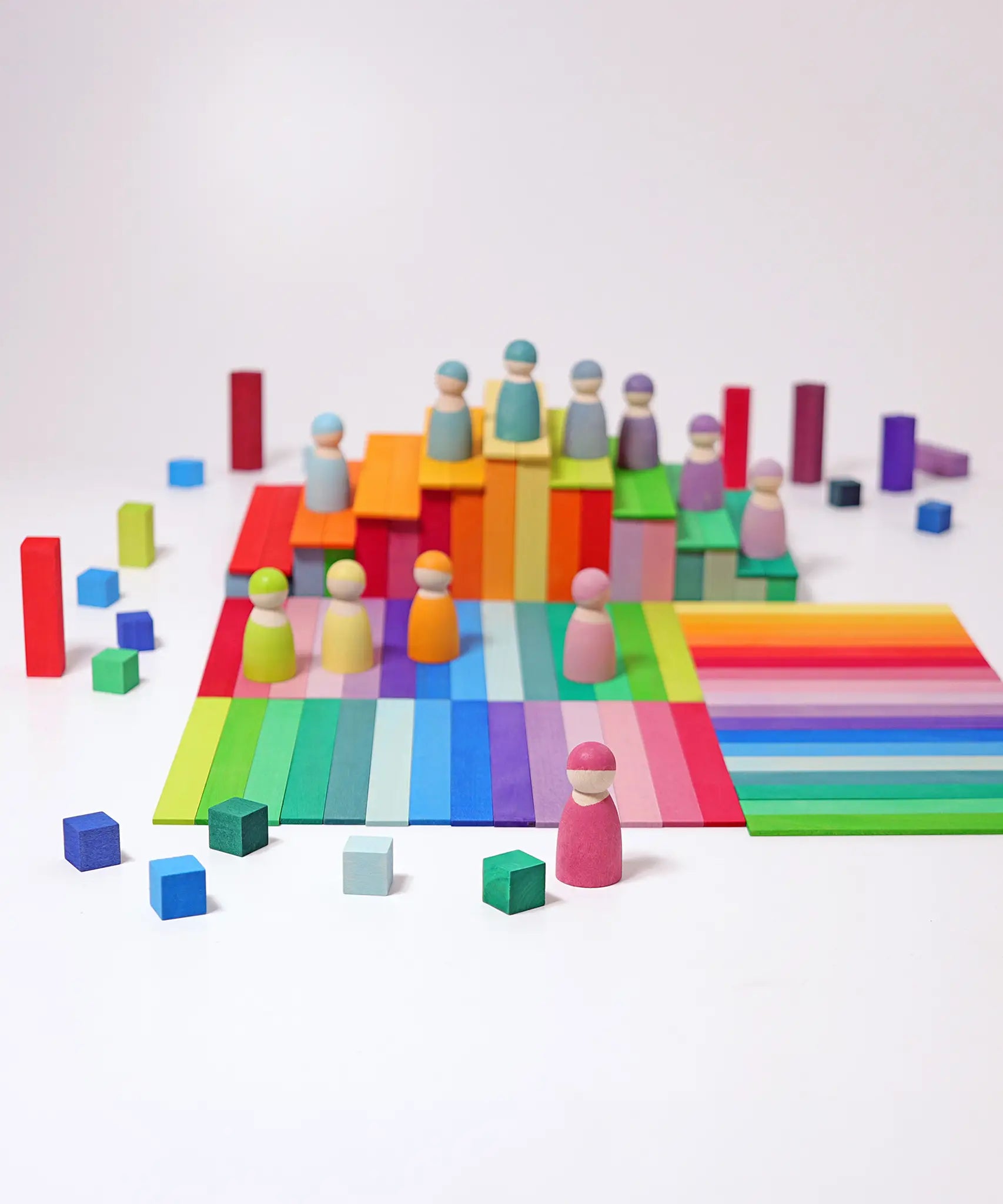 A simple play setup using the Grimms Leonardo sticks, peg dolls and small cube blocks