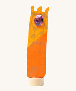 Grimms wooden orange tower decorative figure with hand painted detail of leaves in gold and  a purple gem on the top. Features a small base stand on the bottom to slot in the celebration ring