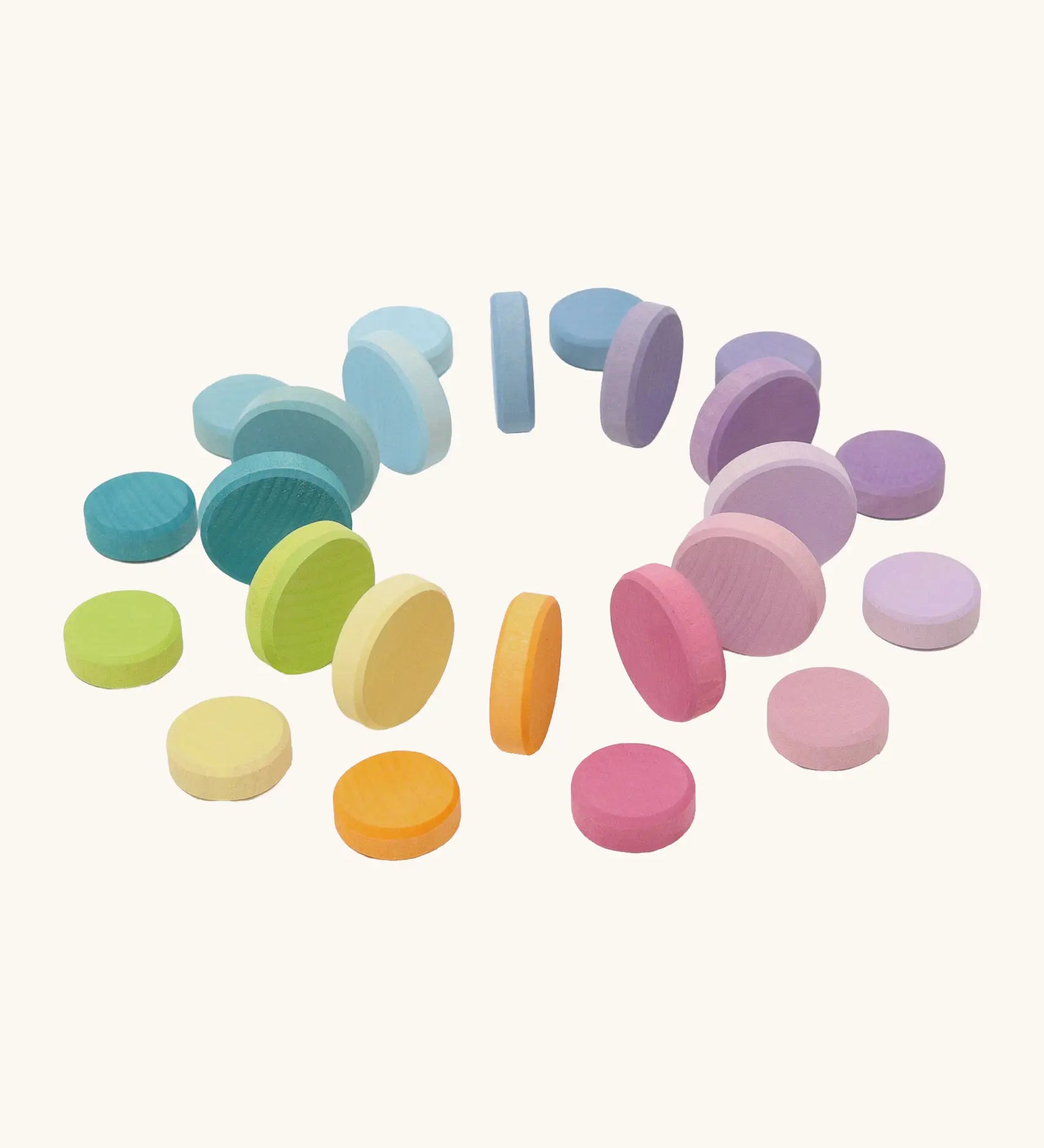 Grimms large and small wooden coins in a pastel palette. Perfect for learning and counting games