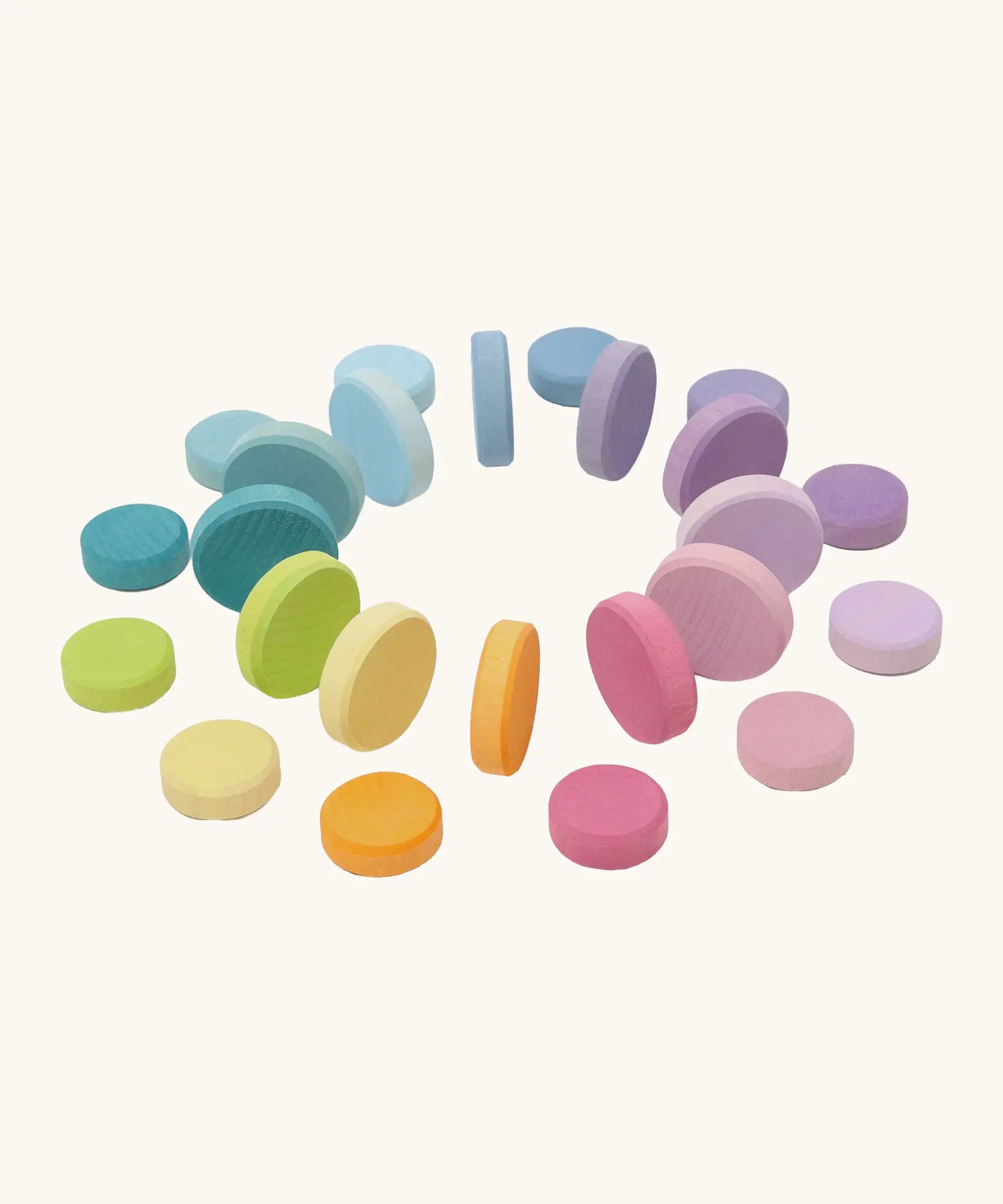 Grimms large and small wooden coins in a pastel palette. Perfect for learning and counting games