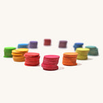 Grimm's Rainbow Confetti Dots on a plain background. Each different colour dots has been stacked together. 
