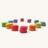 Grimm's Rainbow Confetti Dots on a plain background. Each different colour dots has been stacked together. 