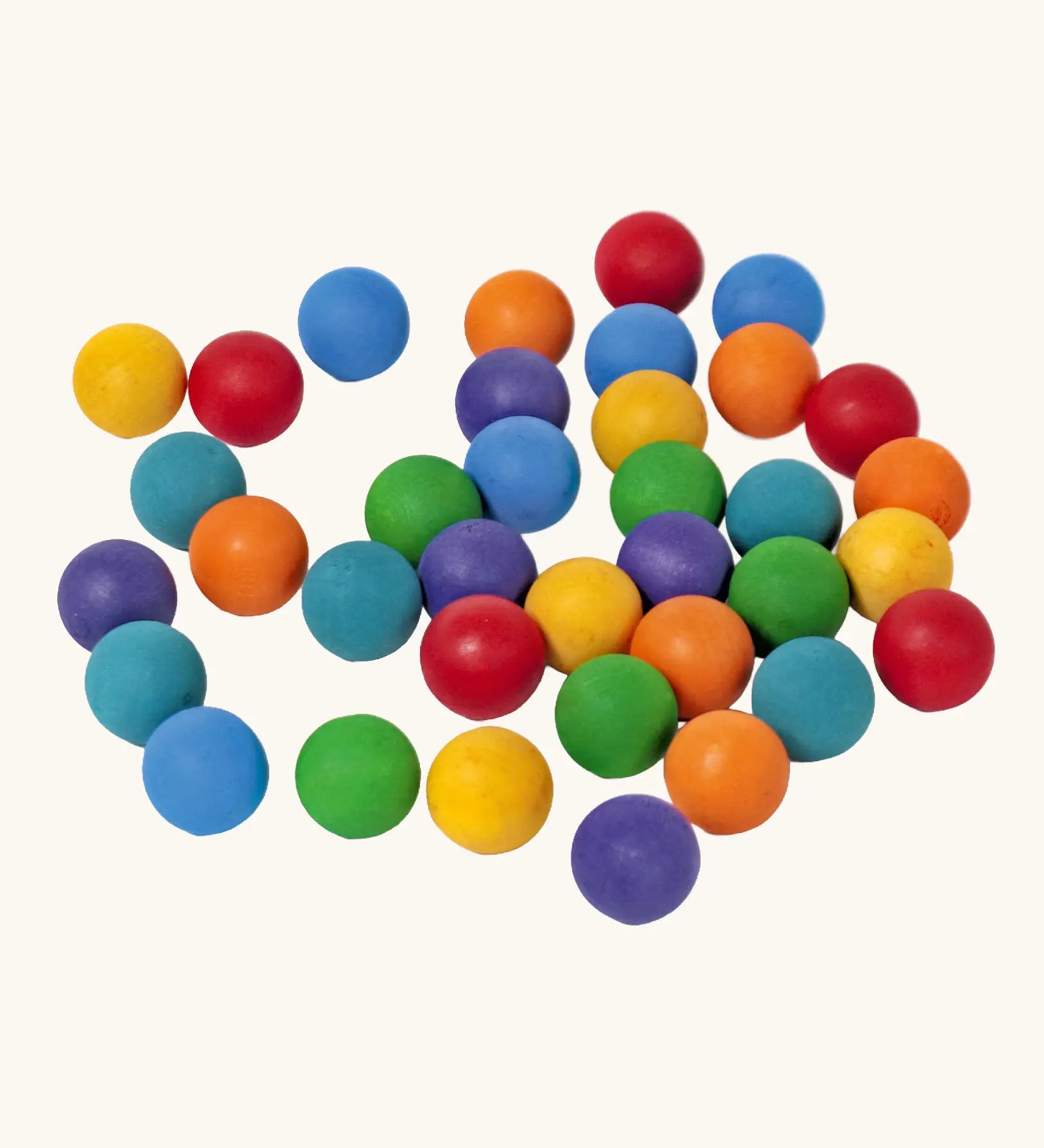 Set of 35 Grimms handcrafted wooden 2cm marbles in a rainbow palette. 