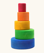 A stack of Grimms brightly coloured  wooden sorting bowls
