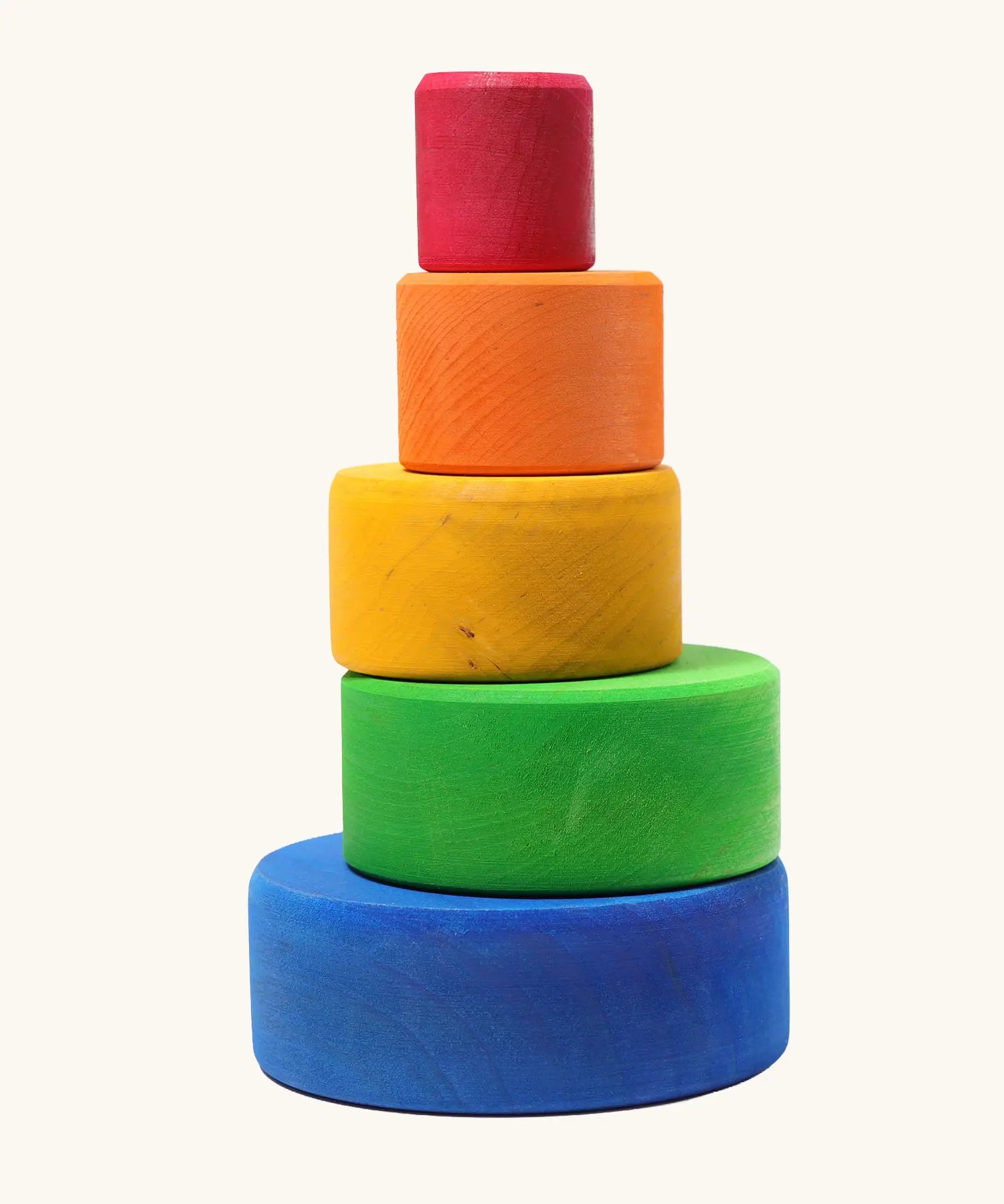 A stack of Grimms brightly coloured  wooden sorting bowls