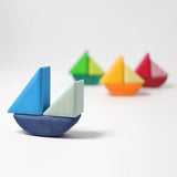 4 little sailboats made from the Grimms handcrafted wooden rolling boats pieces