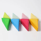 Triangular pieces from the Grimms wooden rolling boats set lined up flat