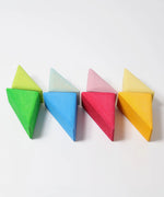 Triangular pieces from the Grimms wooden rolling boats set lined up flat