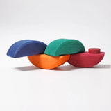 Half sphere pieces the Grimms wooden rolling boats set joined together by the dowels