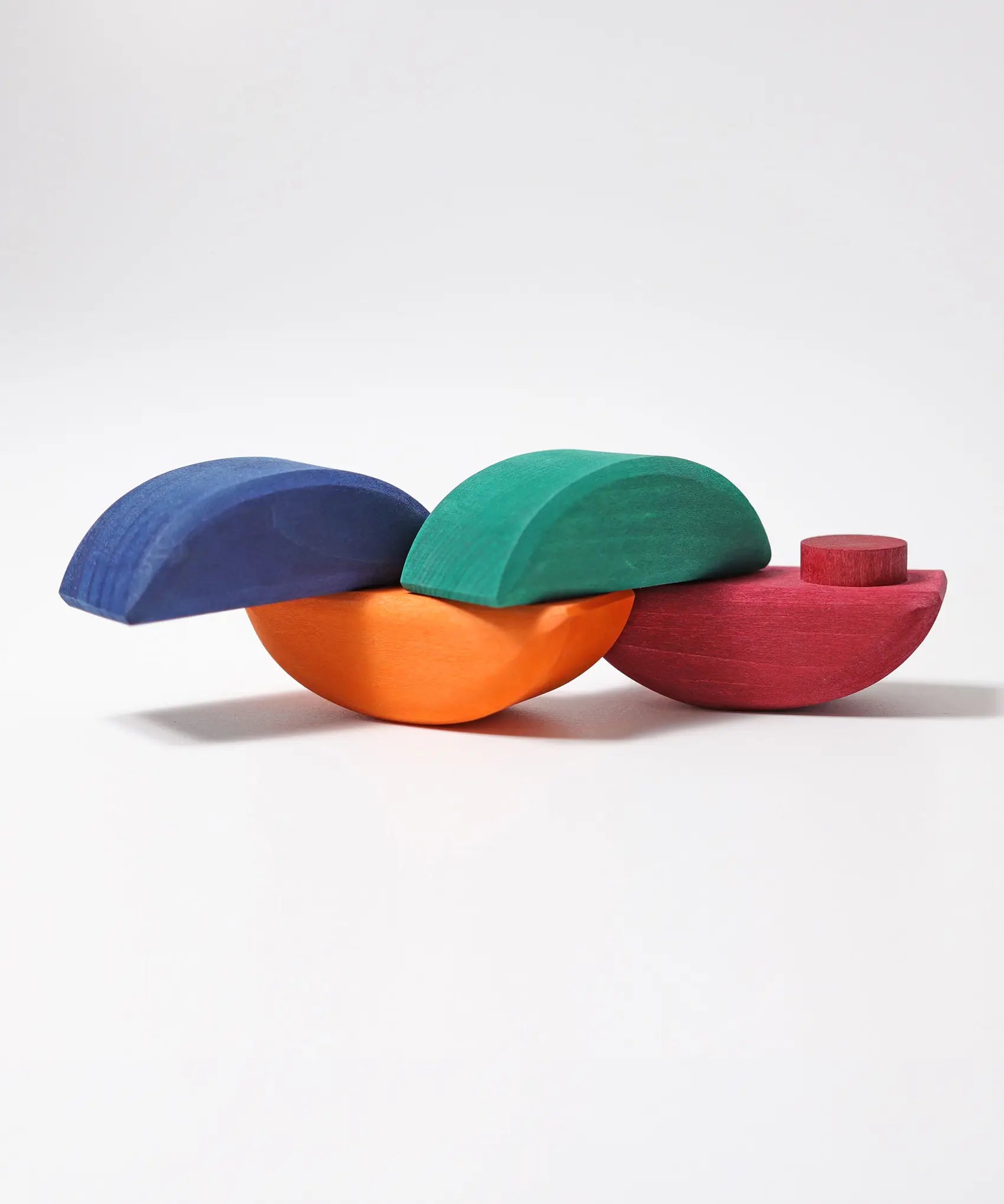 Half sphere pieces the Grimms wooden rolling boats set joined together by the dowels