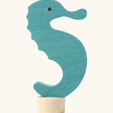 Side of Grimm's handcrafted wooden blue seahorse decorative figure with a unpainted stand