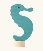 Side of Grimm's handcrafted wooden blue seahorse decorative figure with a unpainted stand