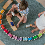 Children playing with the Grimm's Stacking Cars. Wooden toy cars that comes in a two back that can can be stacked on top of each other.
These Grimm's toys are part of a wide range of wooden toys available here at Babipur. 
