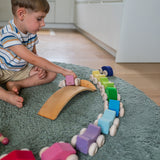 A child playing with the Grimm's Stacking Cars. Wooden toy cars that comes in a two back that can can be stacked on top of each other.
These Grimm's toys are part of a wide range of wooden toys available here at Babipur. 