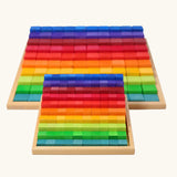 Grimm's small stepped counting blocks in a tray placed in front of the large version.