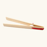 Grimms wooden 18cm tweezers held together by red elastic made to move small such as beads, marbles and small natural objects