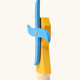 Side of Grimm's handcrafted wooden yellow working windmill