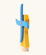 Side of Grimm's handcrafted wooden yellow working windmill