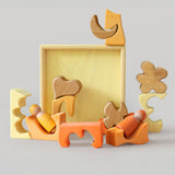 The yellow and natural wooden blocks from the Grimm's yellow building set used in a small world play scene with the Grimm's friends wooden peg dolls. These Grimm's toys are part of a wide range of wooden toys available here at Babipur. 