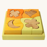 Grimm's Building Set in Yellow. Wooden blocks in variopus shades of yellow and natural wood in a yellow coloured wooden storage tray. These Grimm's toys are part of a wide range of wooden toys available here at Babipur. 