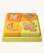 Grimm's Building Set in Yellow. Wooden blocks in variopus shades of yellow and natural wood in a yellow coloured wooden storage tray. These Grimm's toys are part of a wide range of wooden toys available here at Babipur. 