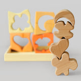 The natural wooden blocks from the Grimm's yellow building set stacked up on top of each other. The yellow an natural wooden blocks from the Grimm's yellow building set stacked up on top of each other. The rest of the pieces and yellow tray can be seen in the background. These Grimm's toys are part of a wide range of wooden toys available here at Babipur. 