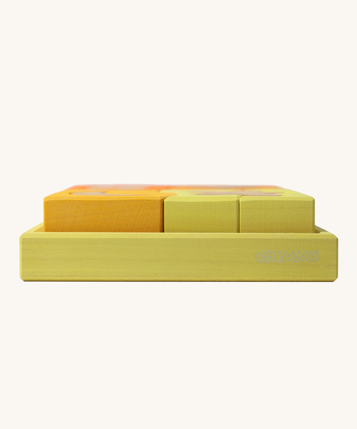 A side profile view of the yellow tray . Grimm's Building Set in Yellow. Wooden blocks in variopus shades of yellow and natural wood in a yellow coloured wooden storage tray. These Grimm's toys are part of a wide range of wooden toys available here at Babipur. 