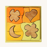Grimm's Building Set in Yellow. Wooden blocks in various shades of yellow and natural wood in a yellow coloured wooden storage tray. These Grimm's toys are part of a wide range of wooden toys available here at Babipur. 