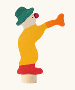 Grimm's yellow clown decorative figure for celebration rings, side profile view.
