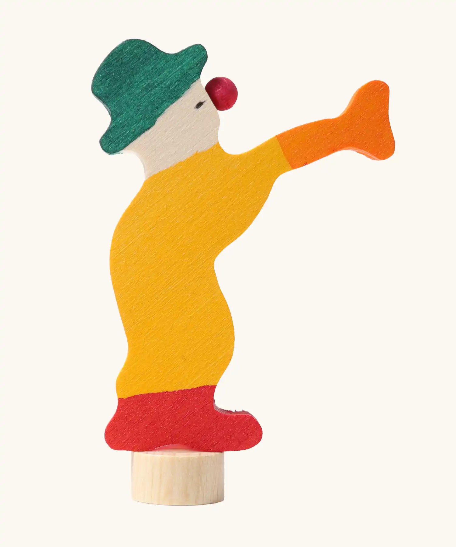 Grimm's yellow clown decorative figure for celebration rings, side profile view.