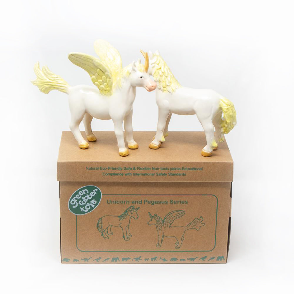 Green Rubber Toys eco-friendly gold unicorn and pegasus toys stood on their cardboard box on a white background
