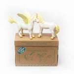 Green Rubber Toys eco-friendly gold unicorn and pegasus toys stood on their cardboard box on a white background