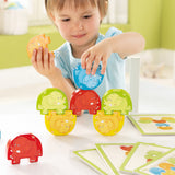 A child playing with the Haba stacking elephants game 