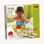 A cardboard box for the Haba elephants stacking game on a cream background.