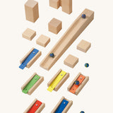  musical blocks and marbles set up on a wooden floor