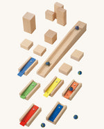  musical blocks and marbles set up on a wooden floor