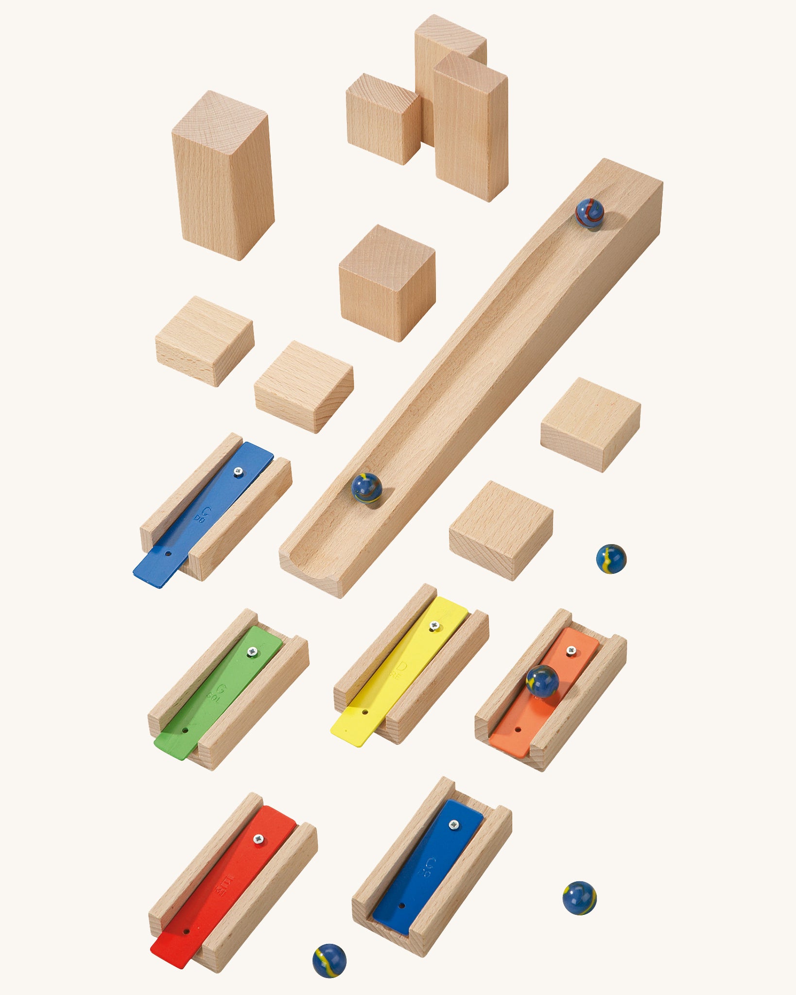  musical blocks and marbles set up on a wooden floor
