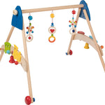 Heimess natural wooden baby gym and walker trainer on a beige background