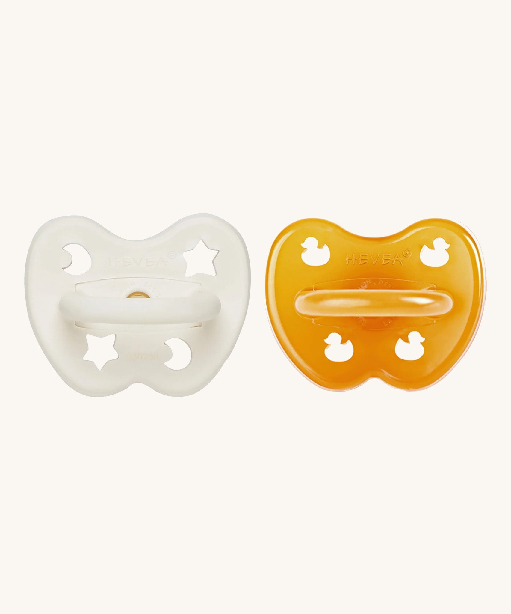 A two-pack of Hevea symmetrical teat baby pacifiers, made from 100% natural rubber and plastic-free. One in a milky white colour and one in a natural orange