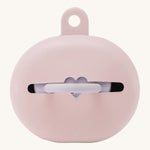 Hevea pink natural rubber baby dummy case with a dummy inside on a beige background