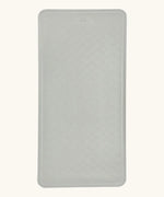 Hevea large natural rubber bath mat in Granite, a light grey, with wave pattern for non-slip.